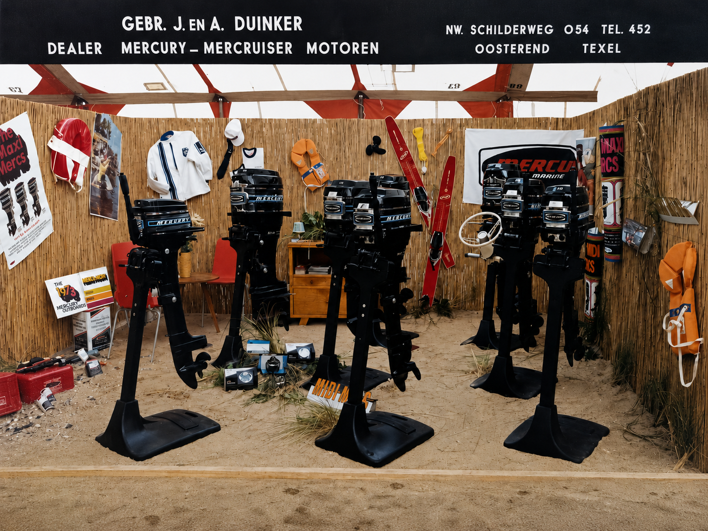 Gebr. J. en A. Duinker Mercury / Mercruiser dealer booth — five vintage Mercury outboards on stands at a watersports show in Oosterend, Texel